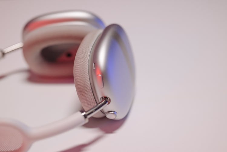 Modern Wireless Headphones On Studio Background