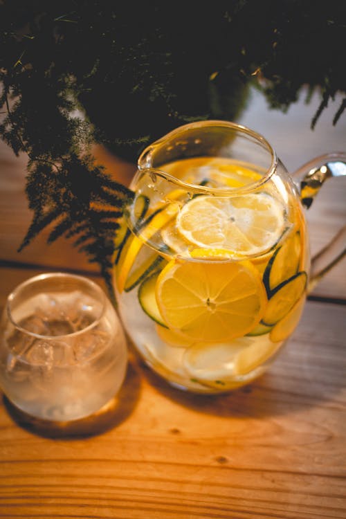 Water with Sliced Lemons in the Glass Pitcher