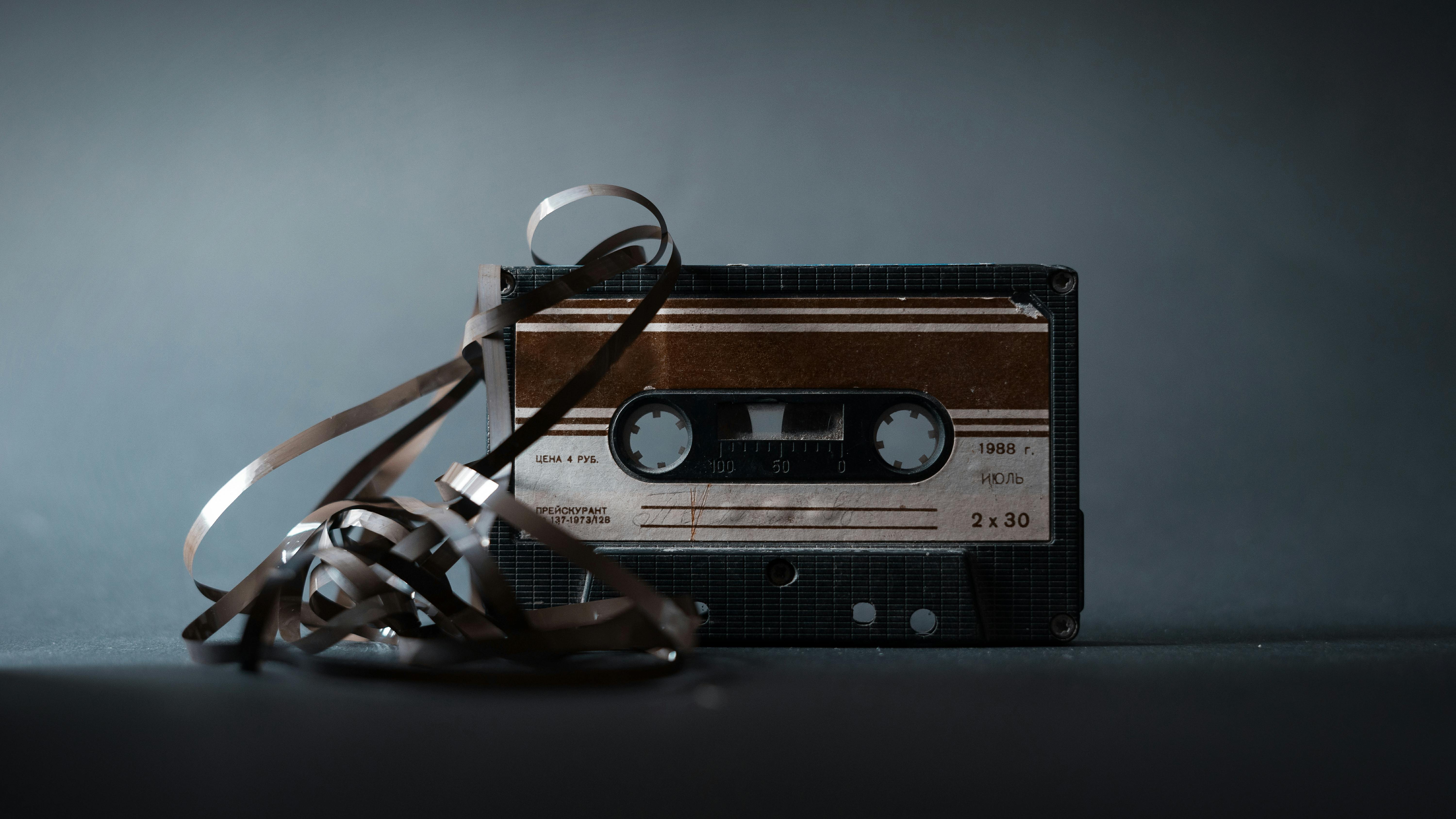 retro cassette with tape on gray background