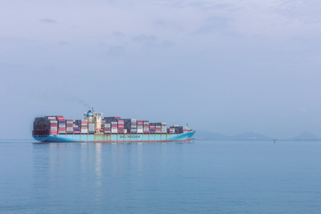 Cargo Ship on Sea Under Blue Sky