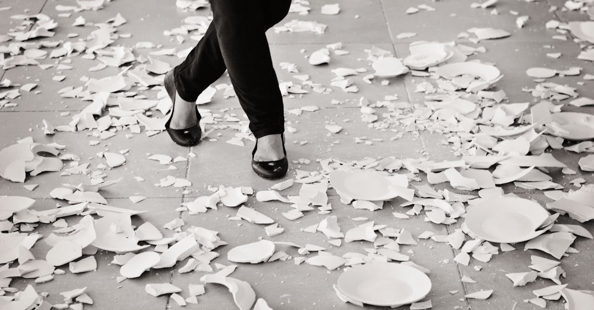 Grayscale of Woman in Black Flat Sandals Walking