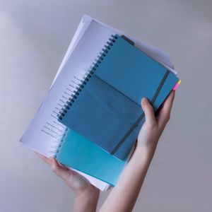 Spiral-bound notebooks and printed pages — photo by Alexandra Krainyukhova on Pexels