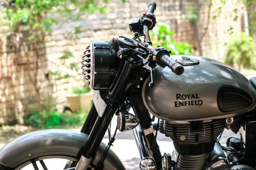 Free Side view of a parked Royal Enfield motorcycle with a focus on the handlebars and tank. Stock Photo