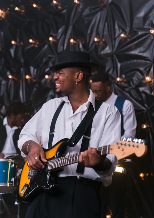 Free Musician performing on electric guitar at a live music event. Stock Photo