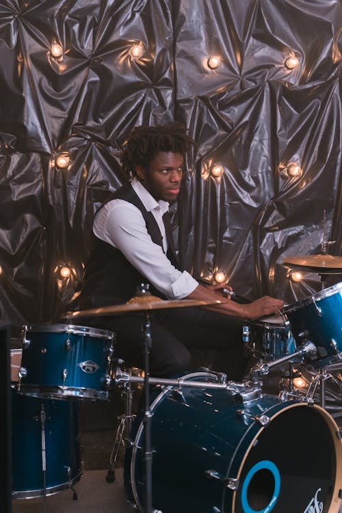 Free Man Playing the Drums Stock Photo