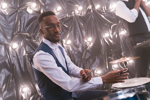 Side View of a Man Playing the Drums