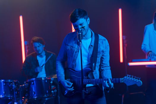 Vibrant band performing with neon lights, featuring electric guitar and drums.