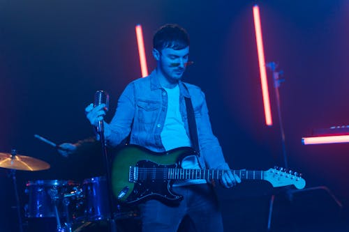 Guitarist Holding the Mic