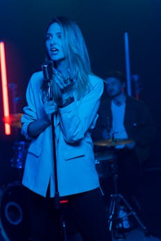 A captivating female singer performing live with a band, creating an energetic atmosphere.