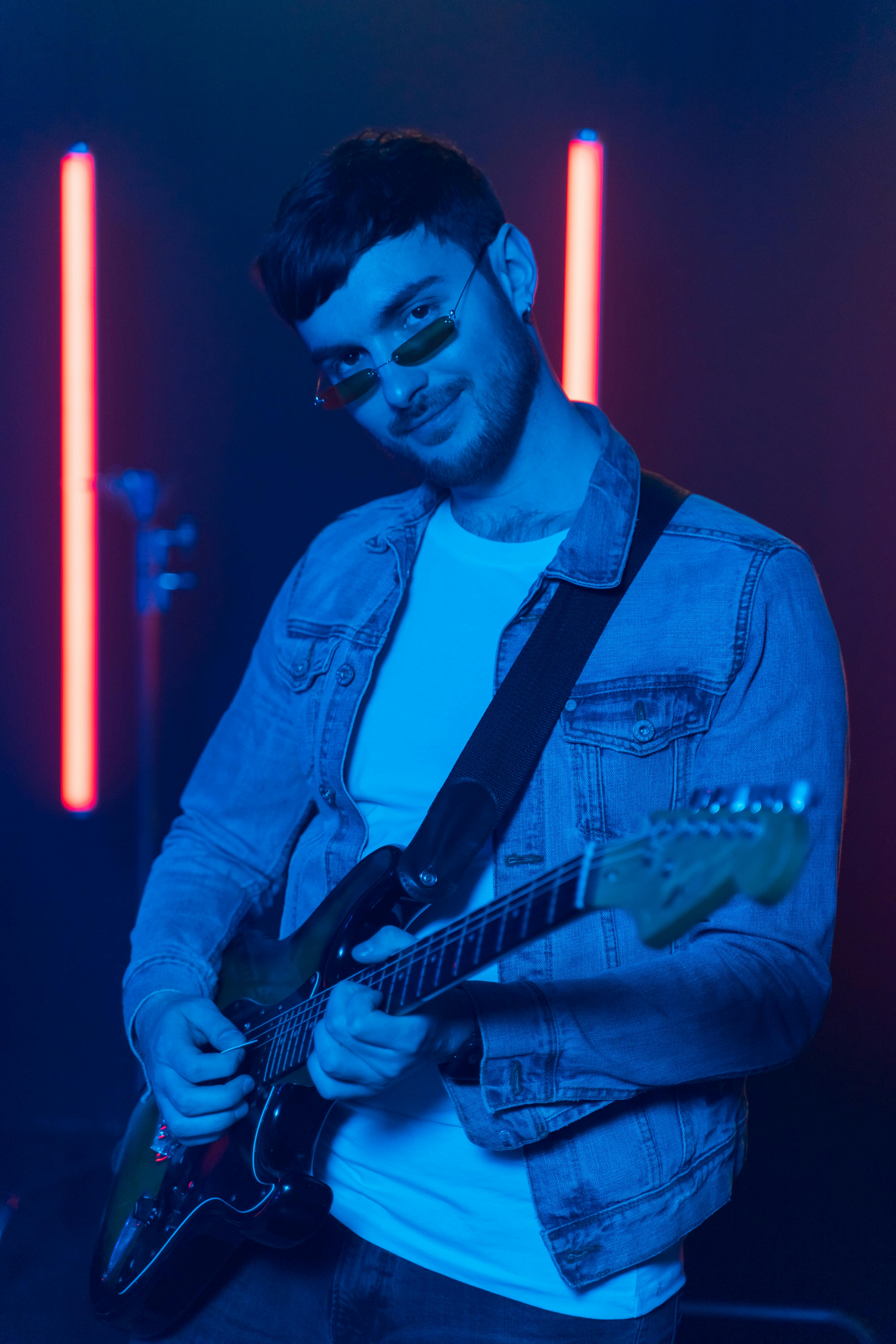 man playing the bass guitar