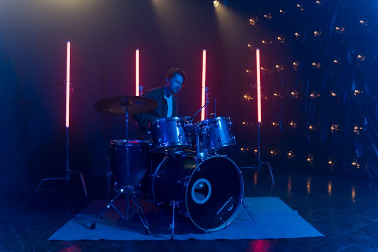 A Drummer Beating The Drum Set