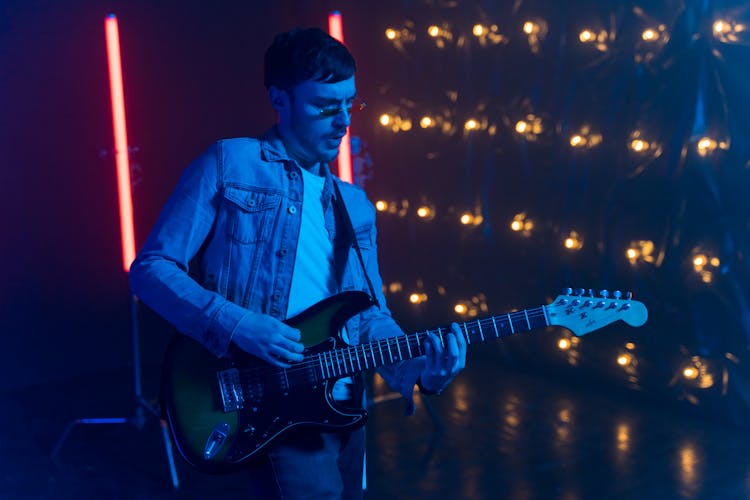 Man Playing Guitar On Concert