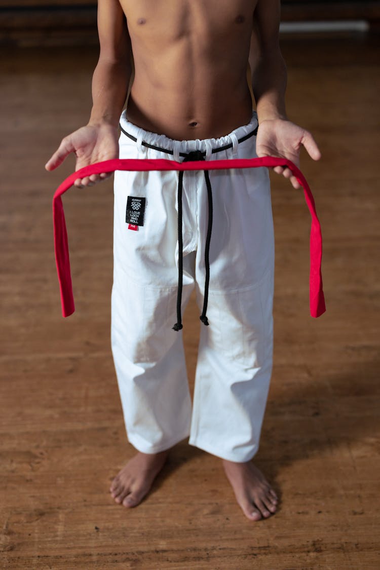 A Boy Holding A Red Headband