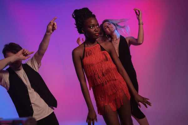 Woman in a fringe dress dancing at a party
