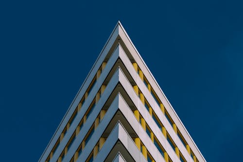 White and Brown Concrete Building Under Blue Sky