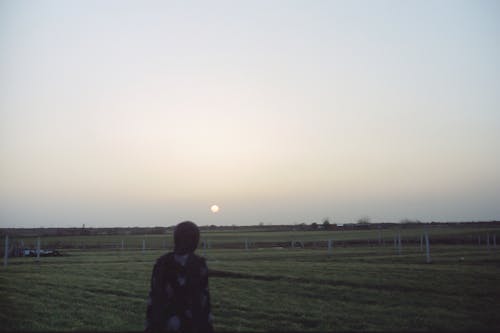 Person Standing On A Farmland