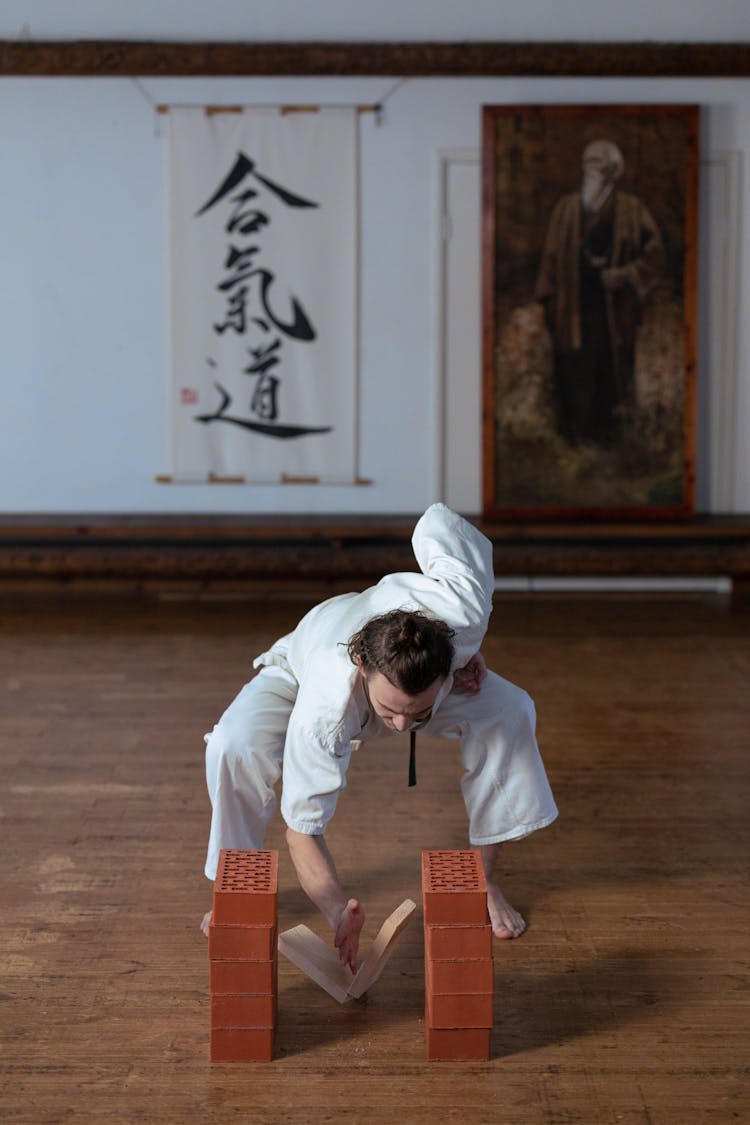 Man Breaking A Board Doing Karate Chop