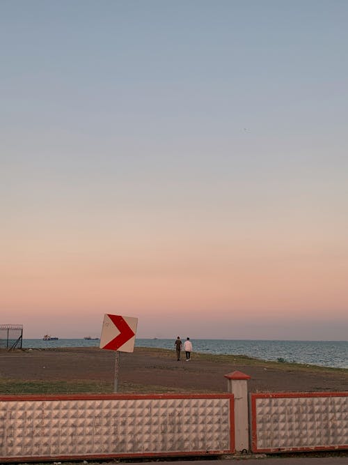 Photos gratuites de le soleil couchant sur la plage