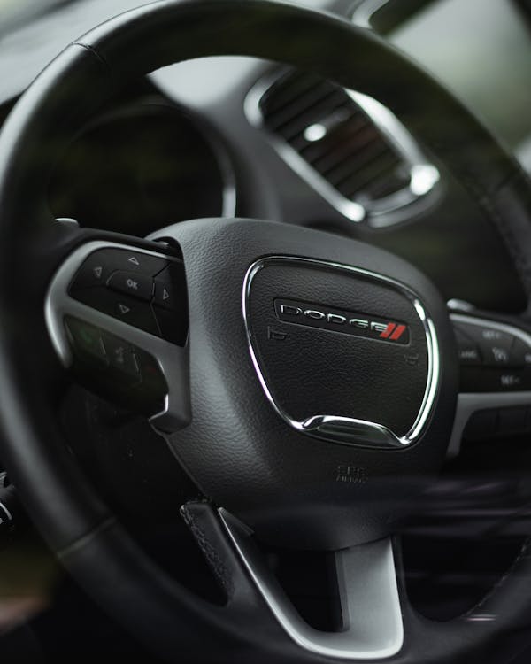 Close-Up Photo of a Black Steering Wheel