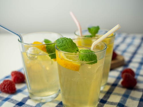 Close-Up Photo of Lemonade in Drinking Glasses