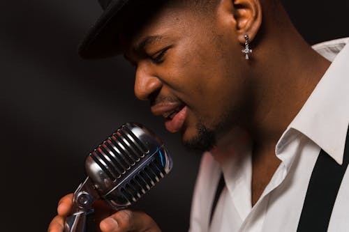 Close-Up Photo of a Man Singing Emotionally