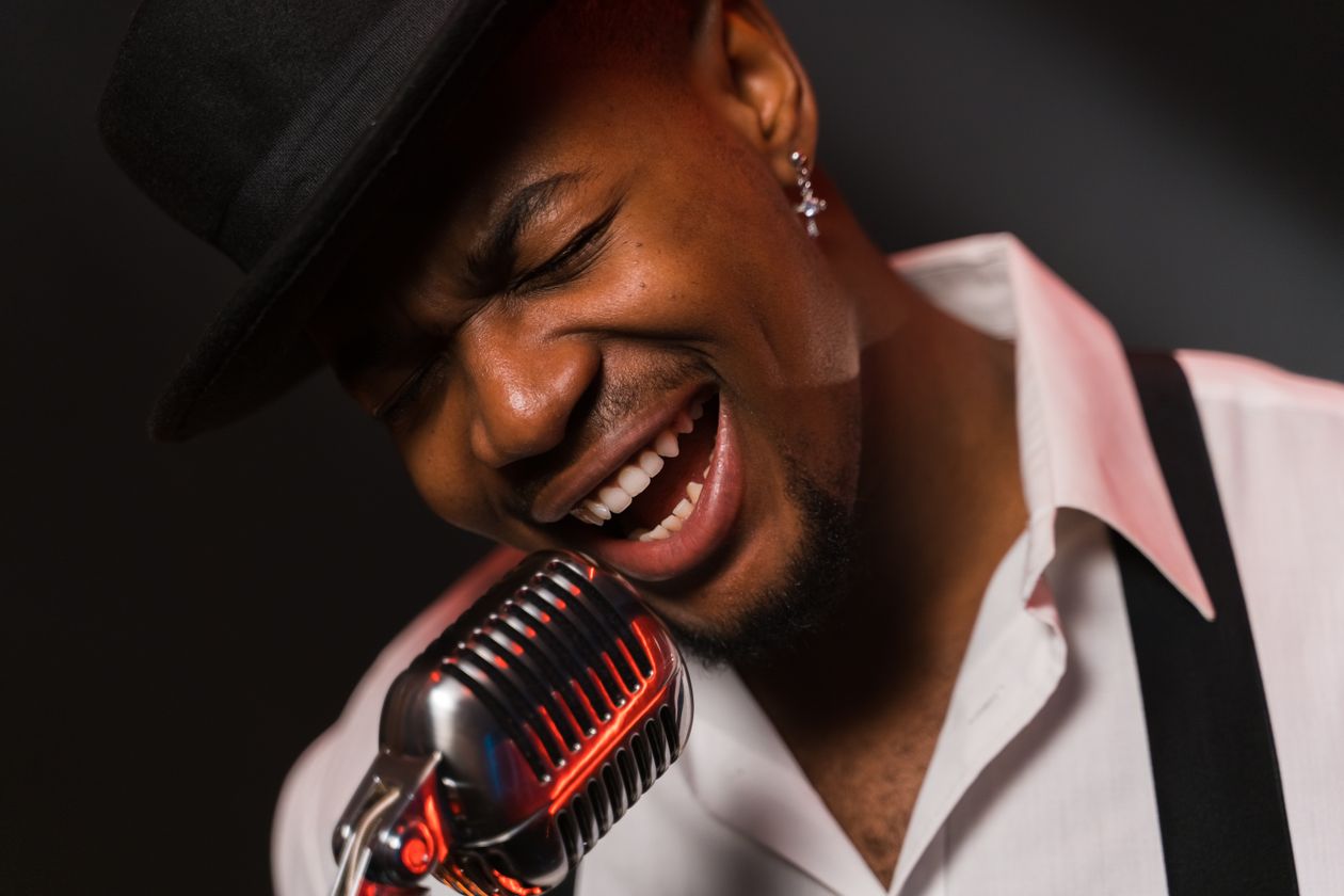 Soul singer performing into a vintage studio microphone