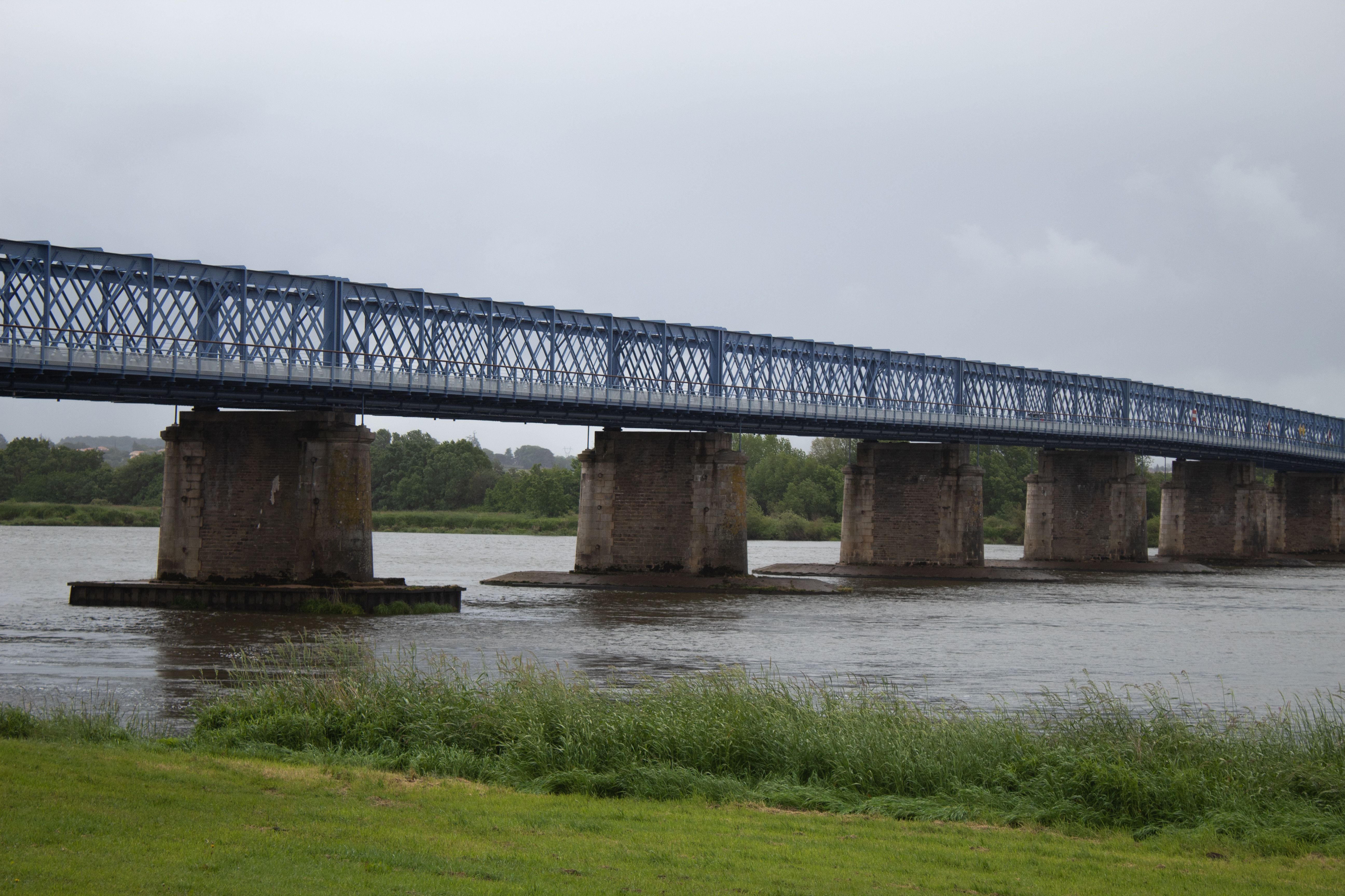 Tadcaster Bridge over the River Wharfe with brewery chimneys behind