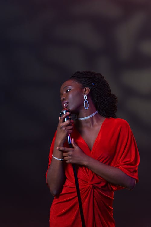 A Female Singer in Red Dress