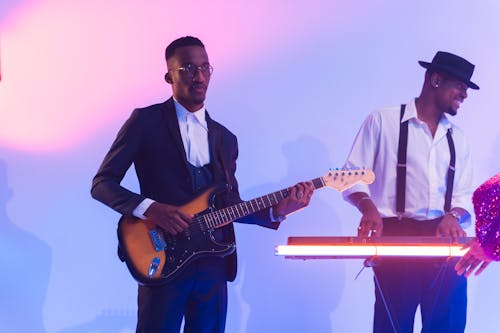 Men Playing Guitar and Keyboard