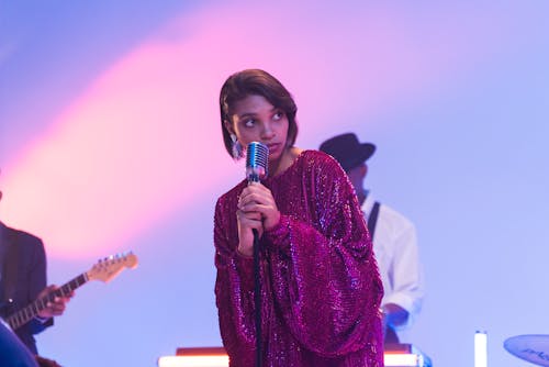 Woman in Violet Dress Singing