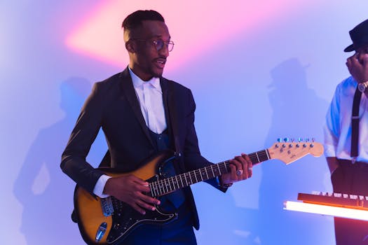 Musician with electric guitar playing live in studio with vibrant lighting.