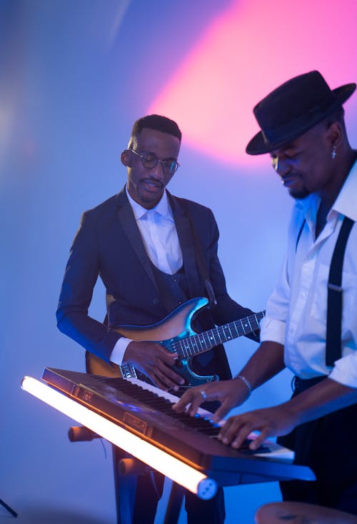 Two Men Playing Musical Instruments