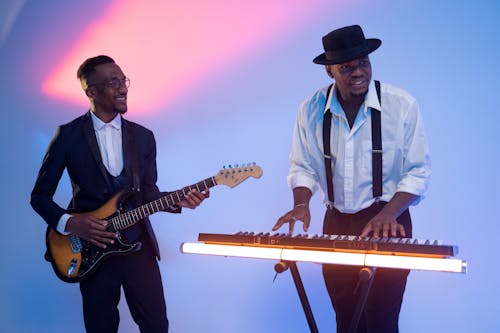 Two Men Playing Musical Instruments