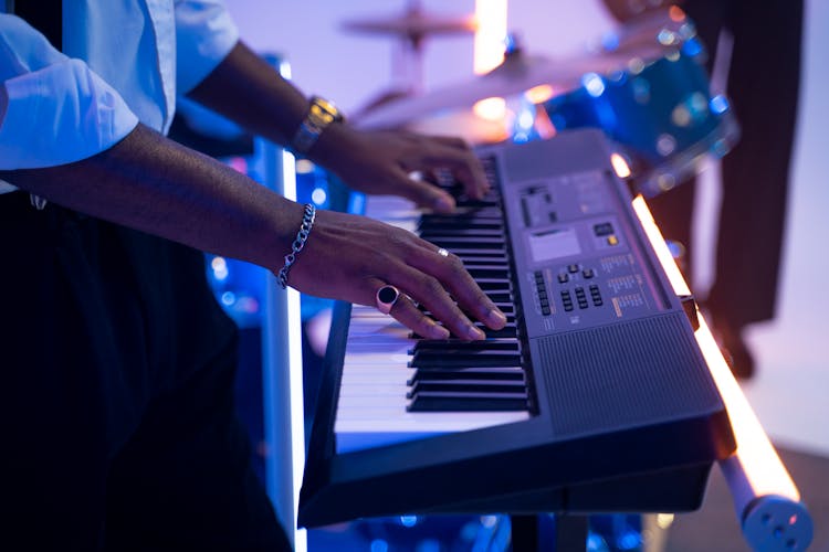 Man Playing Keyboard In Close Up