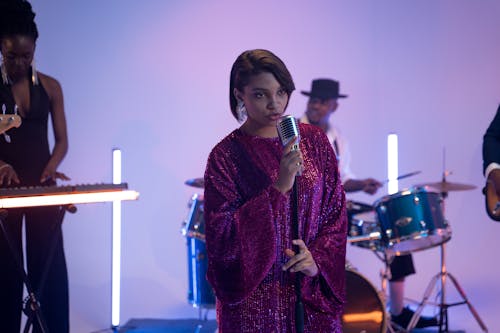 A Woman Singing using Microphone 