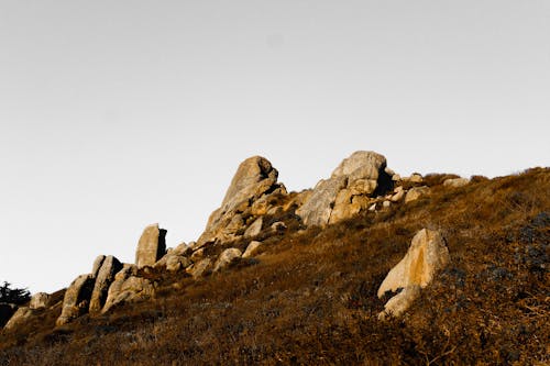 Free Brown Rock Formation Under White Sky Stock Photo