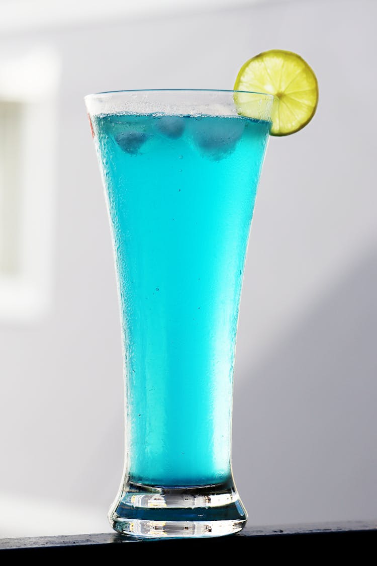 Close-up Of A Blue Drink With Lemon