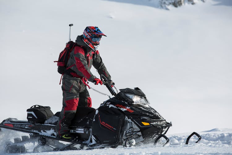 Person Riding On Snowmobile