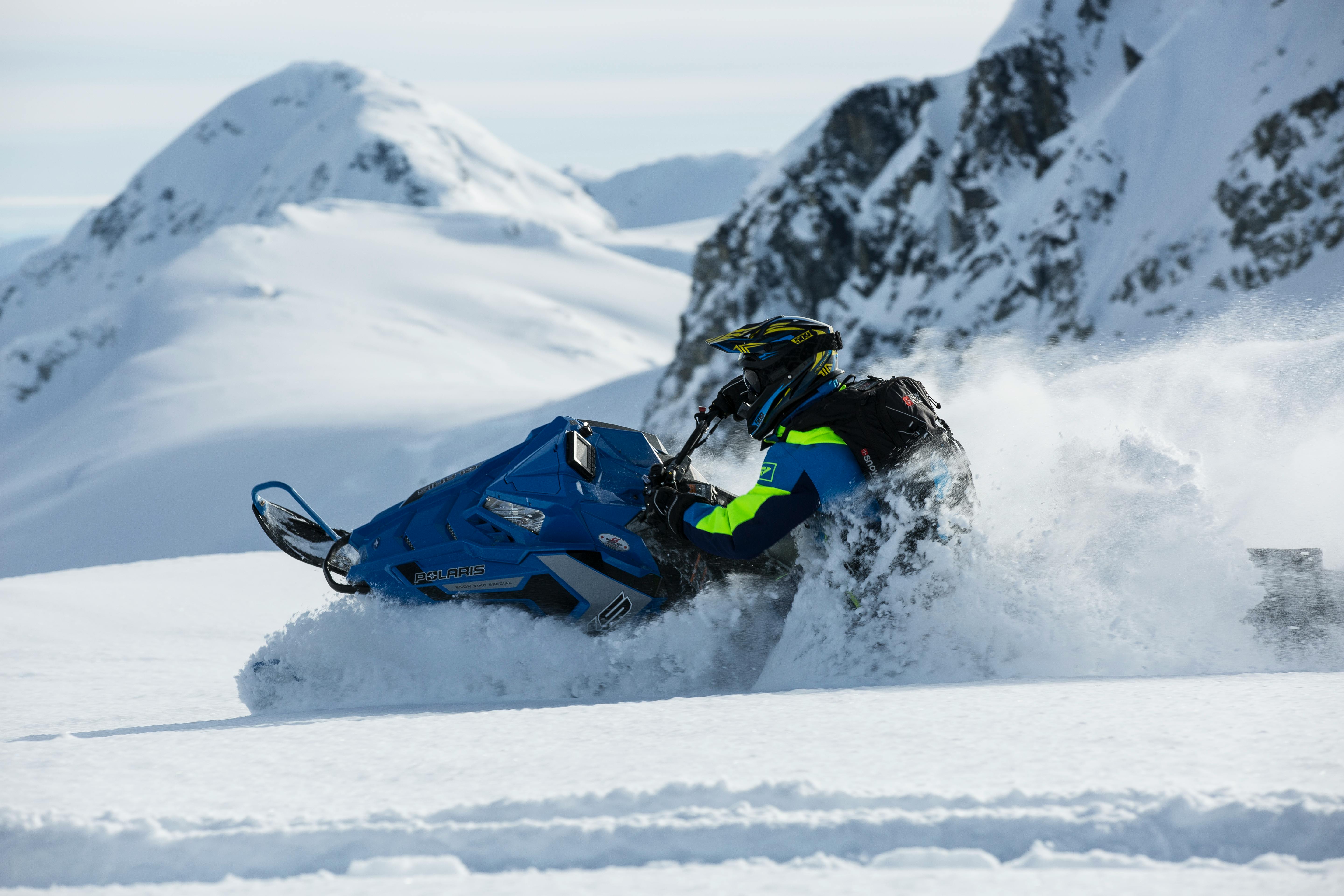 person riding on snowmobile