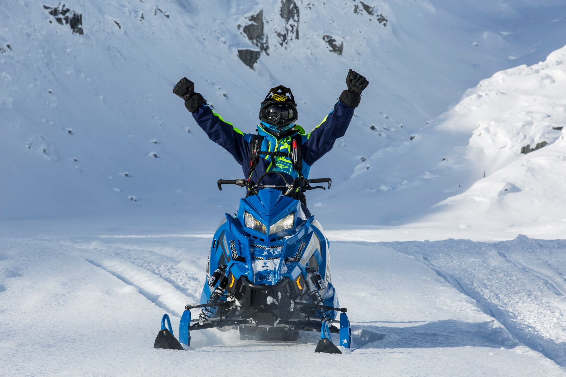 A Takeover guest enjoying a snowmobile experience