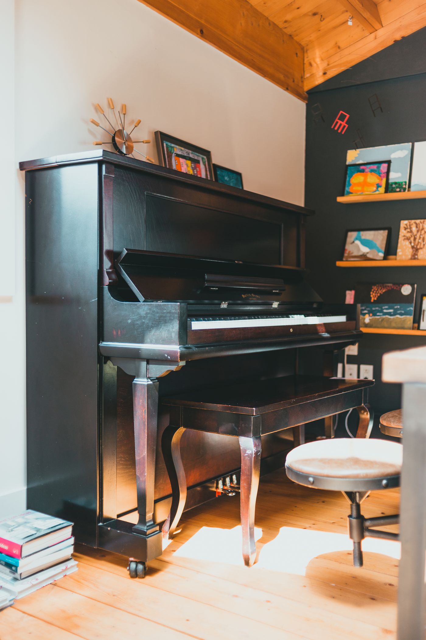 Upright piano in a home before removal