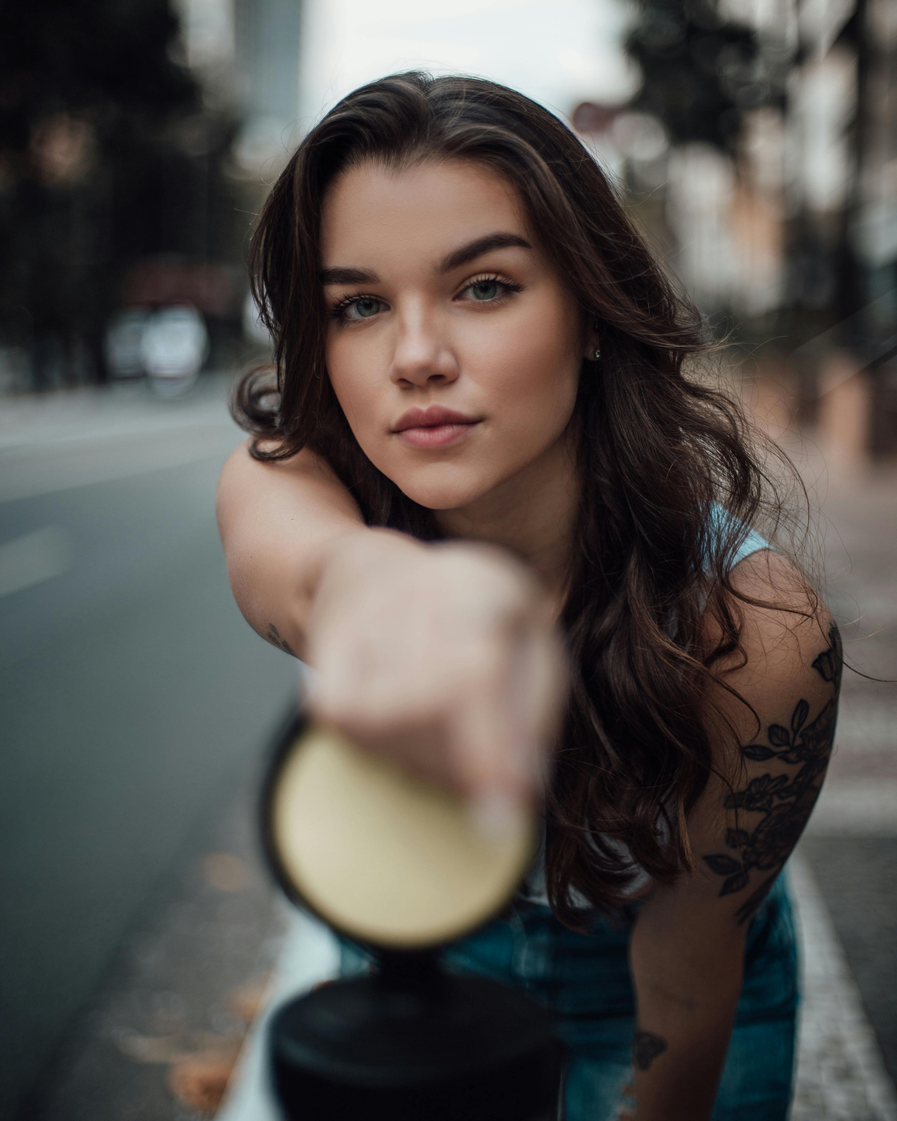 Woman in Black Long Sleeve Shirt Fixing Her Hair · Free Stock Photo Woman in Black Long Sleeve Shirt Fixing Her Hair · Free Stock Photo