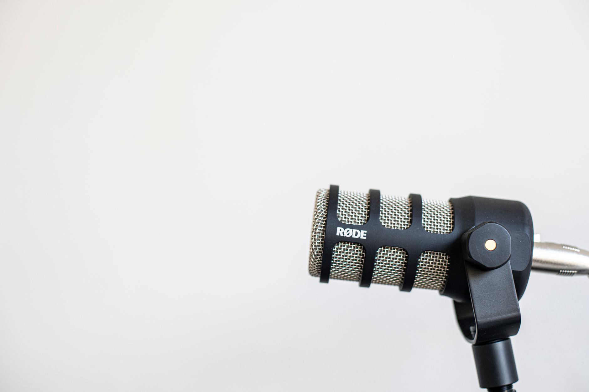 High-quality studio shot of a RΓDE microphone against a plain background.