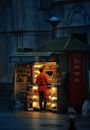 Man buying food in kiosk at night