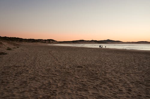 Scenery of a Beach during Dusk