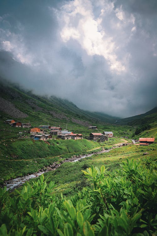 A Village in the Valley Near the Creek Under the Cloudy Sky