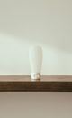 White Ceramic Vase on Brown Wooden Table