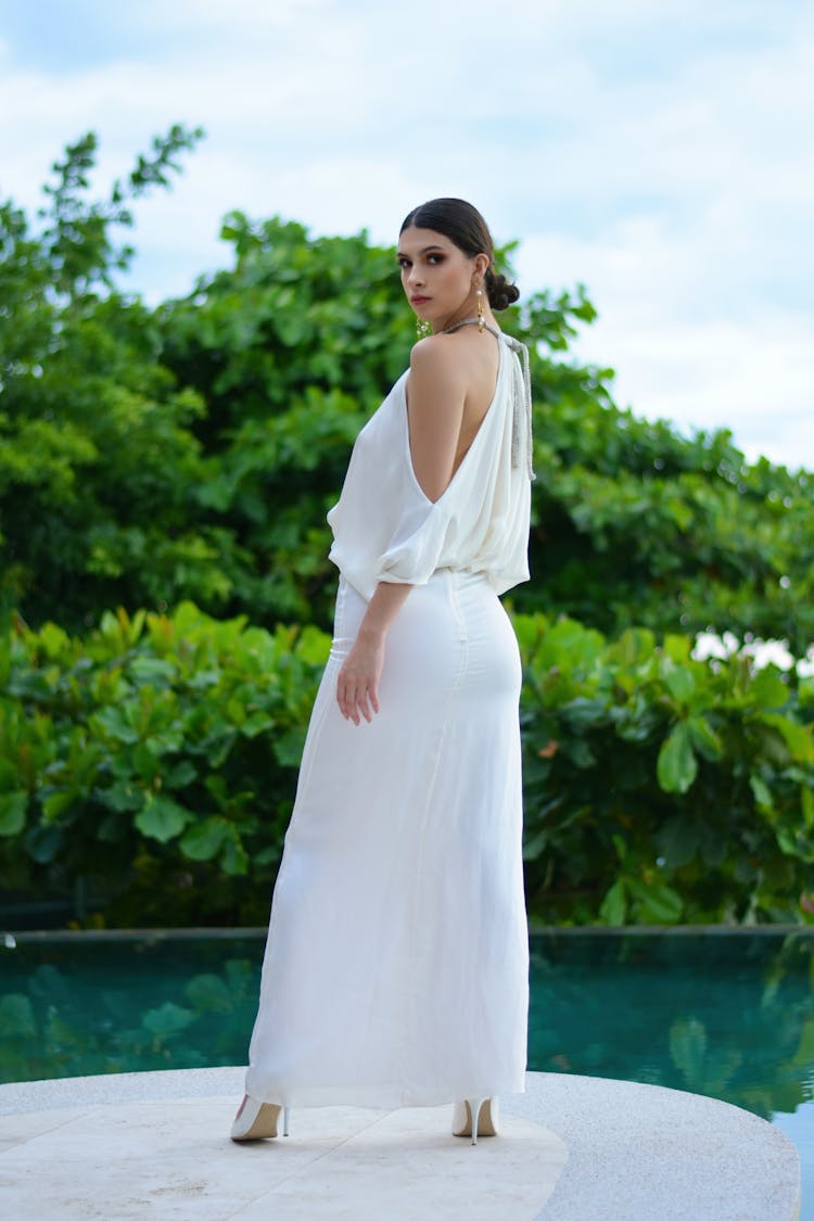  Woman In White Long Dress Looking Back Over Her Shoulder