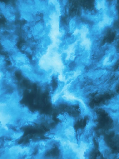 Free A stunning vertical shot of a vibrant, dramatic sky full of clouds. Stock Photo