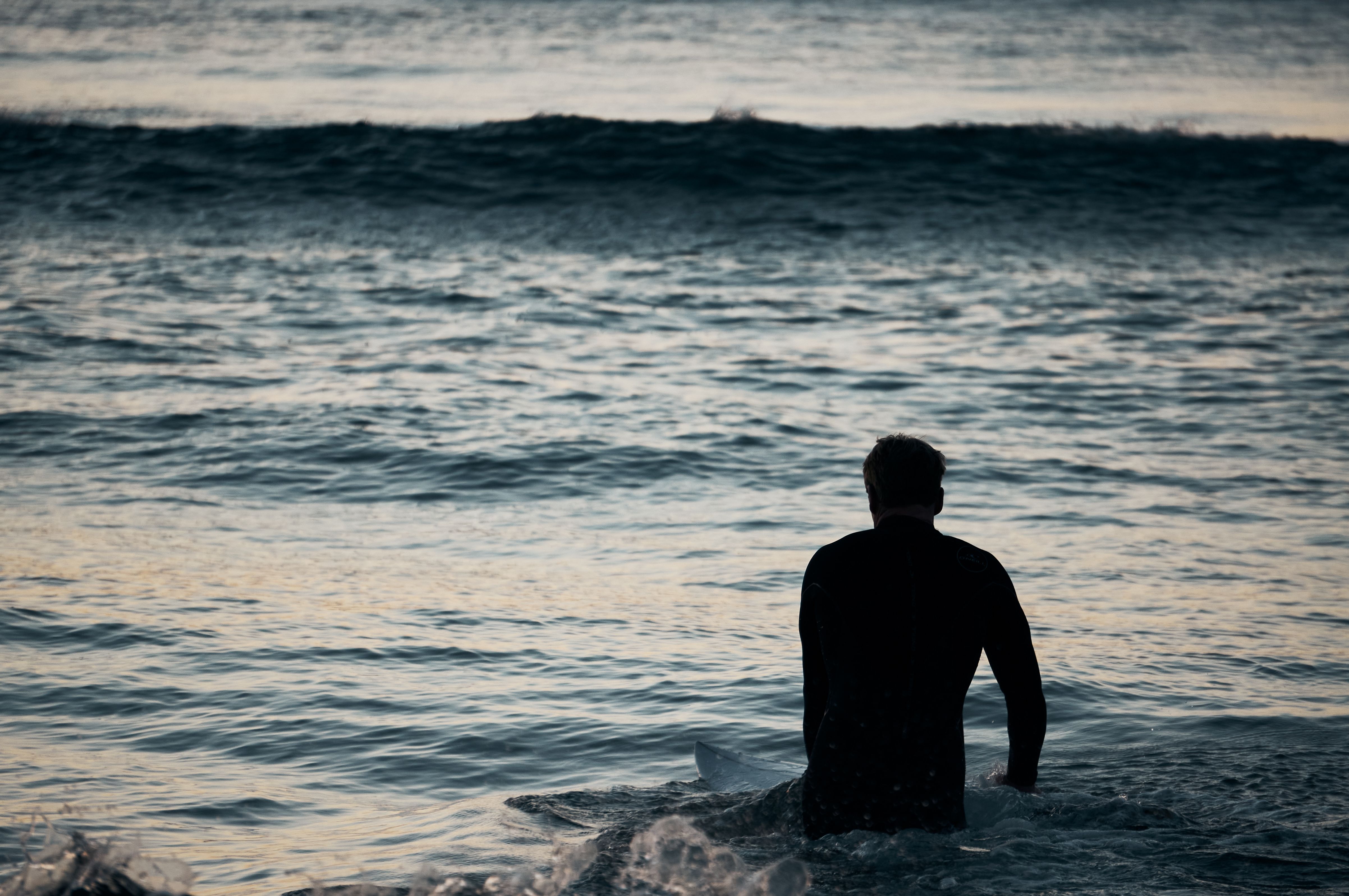 Silhouette of a Man in the Ocean · Free Stock Photo